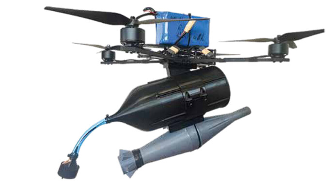 The image shows a drone equipped with a cylindrical body and a missile-like attachment, indicating a specialized design possibly for military or research purposes. (Captioned by AI)